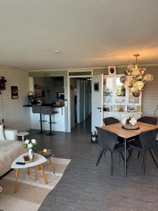 a living room with a table and a couch at Schwarzwaldloge Zeitlos in Brandmatt +13 photos