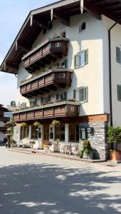 a large building with balconies on the side of it at Gasthof Neumeister in Stumm