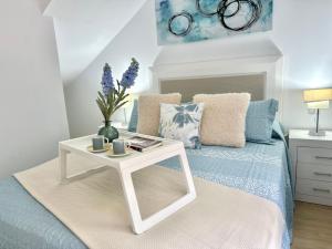 Ένα ή περισσότερα κρεβάτια σε δωμάτιο στο La Esperanza Apartaments