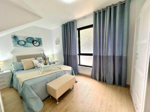 Ένα ή περισσότερα κρεβάτια σε δωμάτιο στο La Esperanza Apartaments