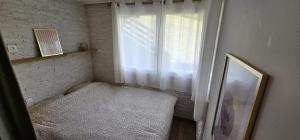 a small room with a window with a bench next to it at Apartment for 4 near the slopes in Chantemerle in Saint-Chaffrey