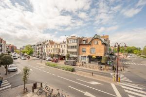 a view of a city street with buildings and cars at Au Louvre De Haan in De Haan