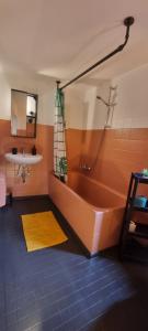 a bathroom with a tub and a sink at Zu Gast im Denkmal St Peter in Dormagen +9 photos