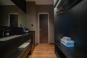 a bathroom with a sink and a counter with towels at Xihe Langyue Hotel Beijing Changying Tianjie Branch in Beijing +20 photos