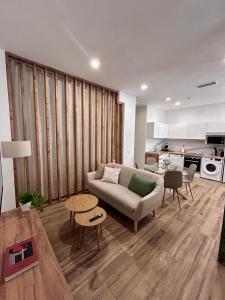 a living room with a couch and a table at Aires de Valencia - Spacious 2-Bedroom Apartment in Valencia