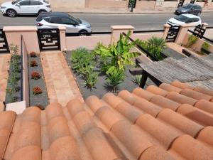 a roof of a building with a table and benches at Casa Azul in Lajares +76 photos