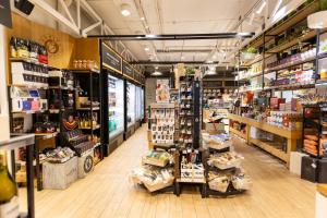 a store aisle with a lot of products on display at Korpa Deli Rooms in Novi Sad