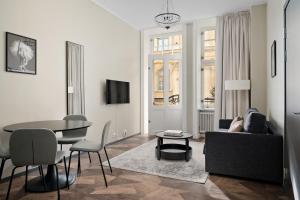 a living room with a couch and a table at Stay Inn Apartments in Vasastan in Stockholm