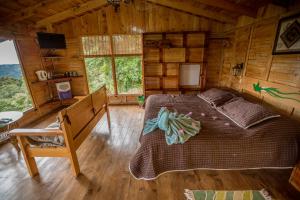 TV a/nebo společenská místnost v ubytování Paraíso Quetzal Lodge