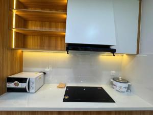a kitchen with a toaster and a microwave on a counter at Caca villa 3 bedrooms in Phu Quoc +21 photos