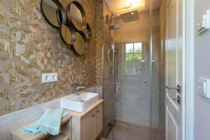 a bathroom with a sink and a shower at Haus Sylter Schönheit in Hörnum +28 photos