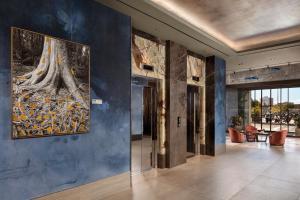 a large painting on a wall in a hallway at VP SOGNIO Metropolitano in Madrid