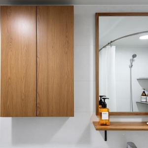 a bathroom with a wooden cabinet and a mirror at Sunny Stay Inn in Seoul +86 photos