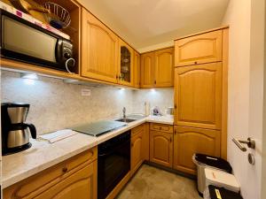 Η κουζίνα ή μικρή κουζίνα στο Hüttenzauber, Montana Haus