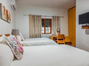 Postel nebo postele na pokoji v ubytování Lancers Inn Hotel + 34 fotografií