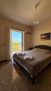 Postel nebo postele na pokoji v ubytování Poros Hills