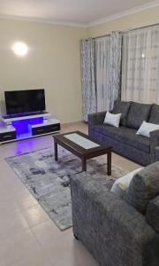 Χώρος καθιστικού στο Naka Stafford near Wanjiru's