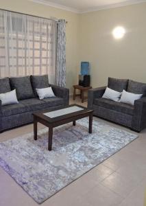 Χώρος καθιστικού στο Naka Stafford near Wanjiru's