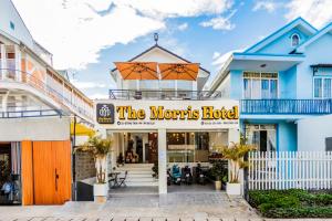 a building with a sign that reads the morocles hotel at The Morris Boutique Hotel 2 - O'TEL in Da Lat