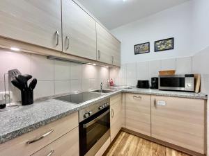 Η κουζίνα ή μικρή κουζίνα στο Gipfeltreff, Montana Haus