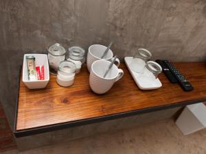 a wooden table with various items on top of it at Tsumeb Theater Guesthouse in Tsumeb