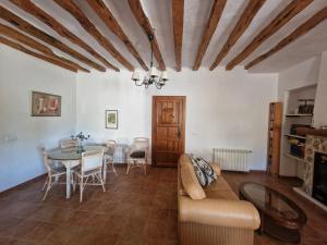 a living room with a couch and a table at Villa Montesa in Elche de la Sierra