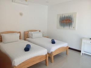 Postel nebo postele na pokoji v ubytování Villa Ravenala + 22 fotografií