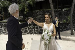 a bride and groom dancing on the beach at Royal Palm Beachcomber Luxury in Grand Baie +93 photos
