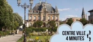 a picture of a large building with the words centre village a minutes at Charmant appartement au coeur de Rueil-Malmaison in Rueil-Malmaison