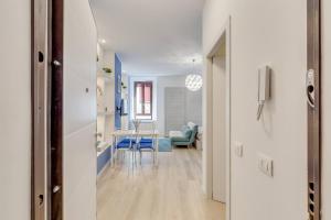 a hallway with a table and a dining room at Cortevecchia#13 in Ferrara
