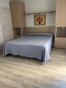 a bedroom with a bed with a blue bedspread at Vista Mare in Pineto +14 photos