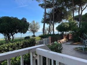 a white fence with a view of the beach at Vista Mare in Pineto