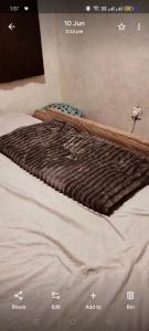 Ένα ή περισσότερα κρεβάτια σε δωμάτιο στο Swahili homes bnb