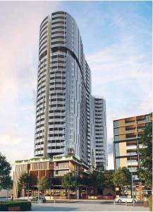 a large tall building with a lot of windows at High-Rise Balcony Unit with City Views Gym Pool in Melbourne