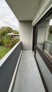 a balcony of a building with a window at La Corniche in Thonon-les-Bains