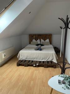 a bedroom with a large bed in a attic at Brasov Cucu Residence in Braşov