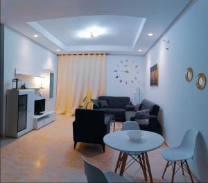 a living room with a couch and a table at Zenitude in Casablanca