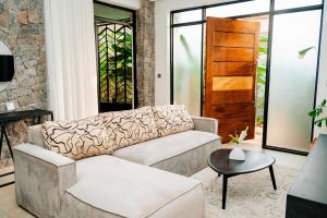 a living room with a couch and a table at Ndare Eco Ville in Kigali