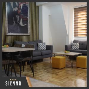 a living room with a couch and a table at City Gallery by Sienna in Skopje