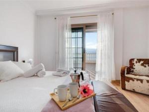 Giường trong phòng chung tại Karat Villa Horizonte +22 ảnh