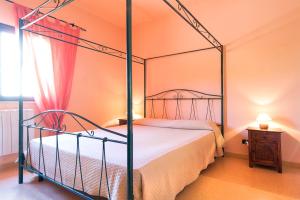 Llit o llits en una habitació de Villa Maria Antonietta