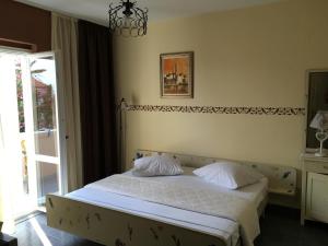 Postel nebo postele na pokoji v ubytování Apartmani Zorica