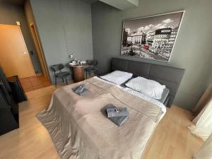 a bedroom with a large bed with a japan at M-Studio Apartments in Stuttgart Zentrum in Stuttgart
