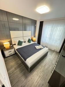 Postel nebo postele na pokoji v ubytování Bucharest Luxury Glam Apartments City Center Area