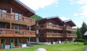 a large building with balconies on the side of it at Residence Edelweiß in Bellwald in Bellwald