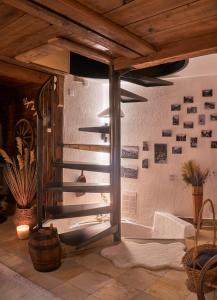 a room with a wall with photographs on the wall at Bed&Museum Alpine Nomads in Chalais