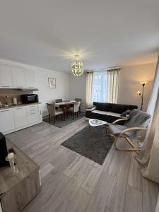 a living room with a couch and a table at Apartman MATEA in Pirot