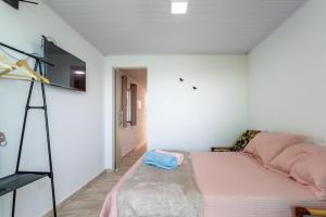 Postel nebo postele na pokoji v ubytování Loft em condominio com mar em Mangaratiba