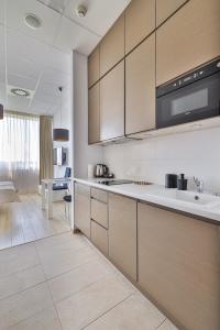 a kitchen with a sink and a counter top at Aleje Jerozolimskie 216 By Perfect Apart in Warsaw