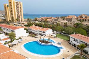 an aerial view of a resort with a swimming pool at Fabulous two bedroom apartment near las Vistas Beach in Los Cristianos in Arona